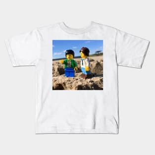 Two Minifigures at the Beach in the Sand Kids T-Shirt